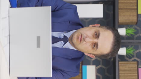Vertical-video-of-Tired-businessman-unhappy-and-sad.